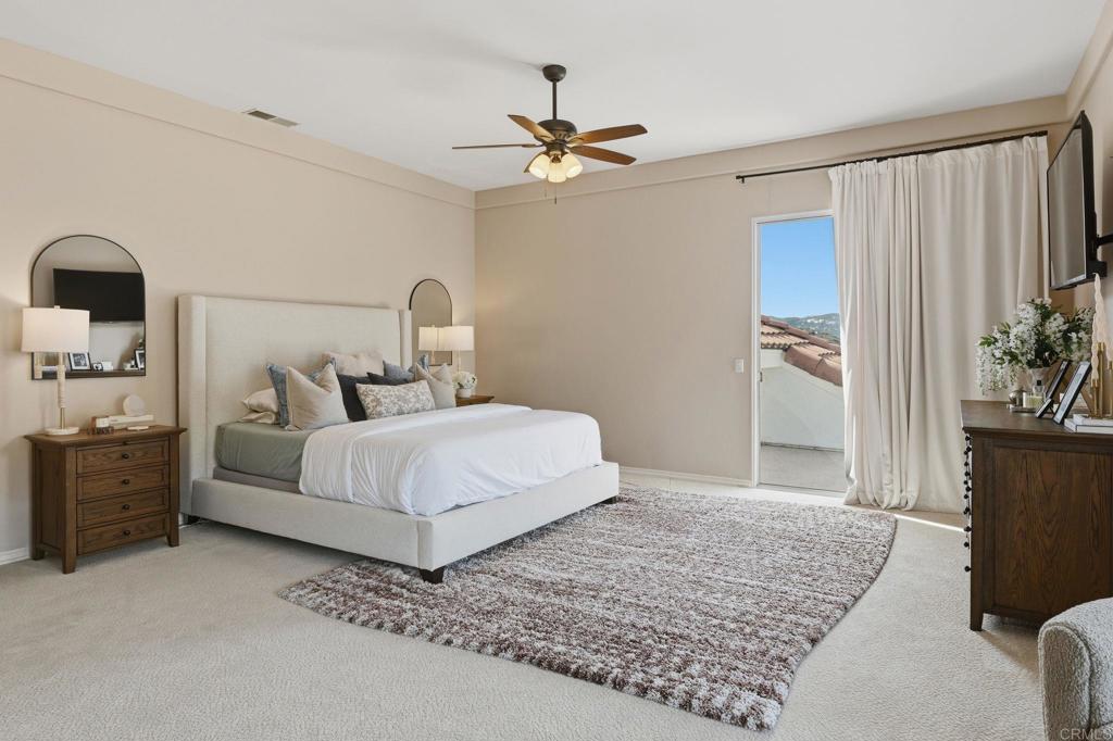 2852 Conestoga Court Alpine, CA 91901 - Photo 29 of 65 a bedroom with a large bed and a chandelier