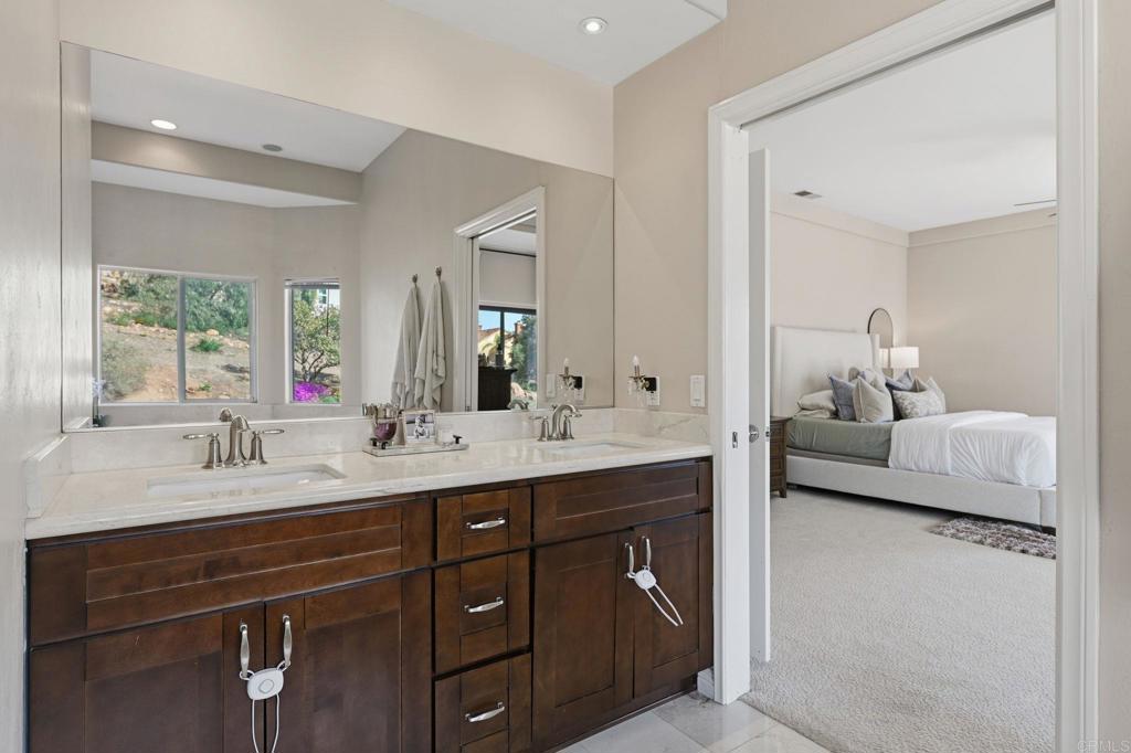 2852 Conestoga Court Alpine, CA 91901 - Photo 34 of 65 a en suite bathroom with double sink and a mirror