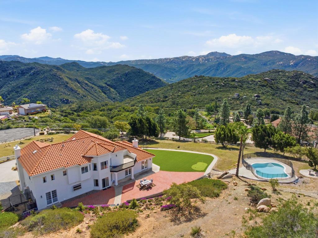 2852 Conestoga Court Alpine, CA 91901 - Photo 4 of 65 a view of a house with a yard and a large pool