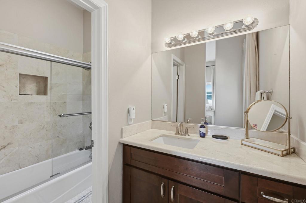 2852 Conestoga Court Alpine, CA 91901 - Photo 41 of 65 a bathroom with a double vanity sink mirror and bathtub