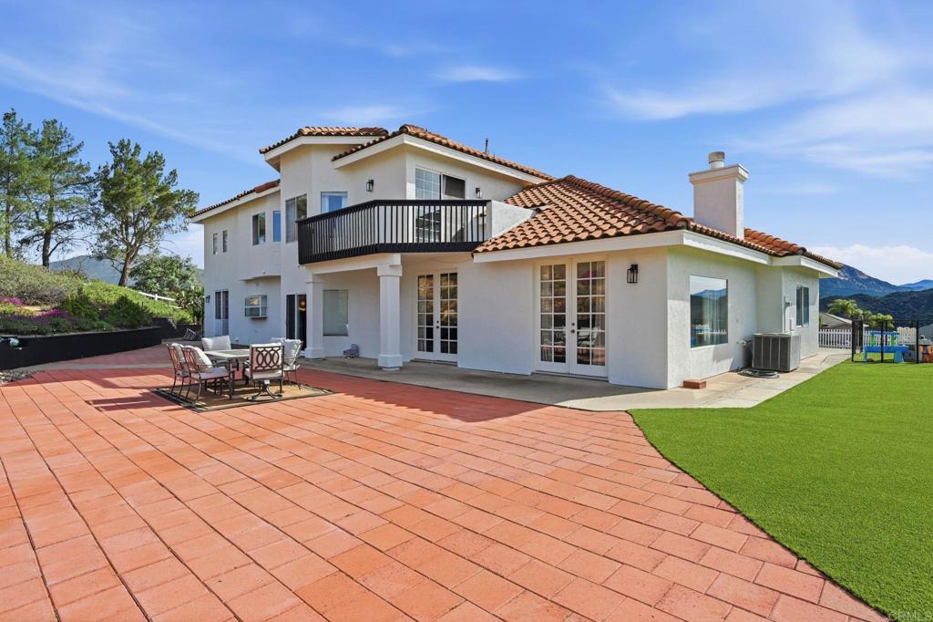2852 Conestoga Court Alpine, CA 91901 - Photo 46 of 65 a front view of a house with yard and green space