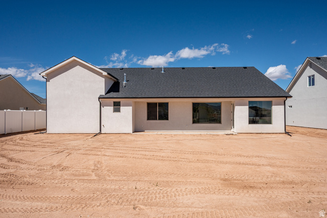 4978 North 75 East Enoch, UT 84721 - Photo 36 of 60 Rear view of property with roof with shingles and stucco siding