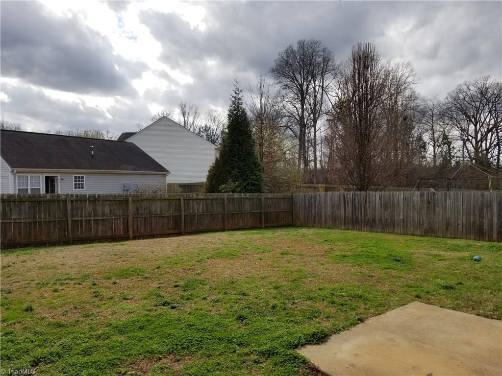 315 Apple Ridge Road Greensboro, NC 27406 - Photo 4 of 22 Fenced in backyard provides privacy
