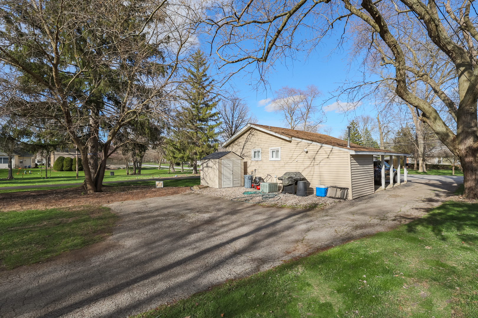 5938 Dunham Road Downers Grove, IL 60516 - Photo 3 of 11 a view of a trees and barn in the back yard