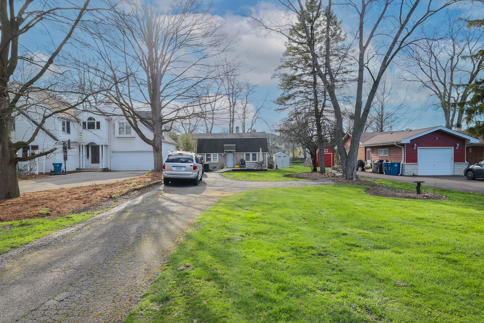 5938 Dunham Road Downers Grove, IL 60516 - Photo 5 of 11 a front view of a house with a garden and trees