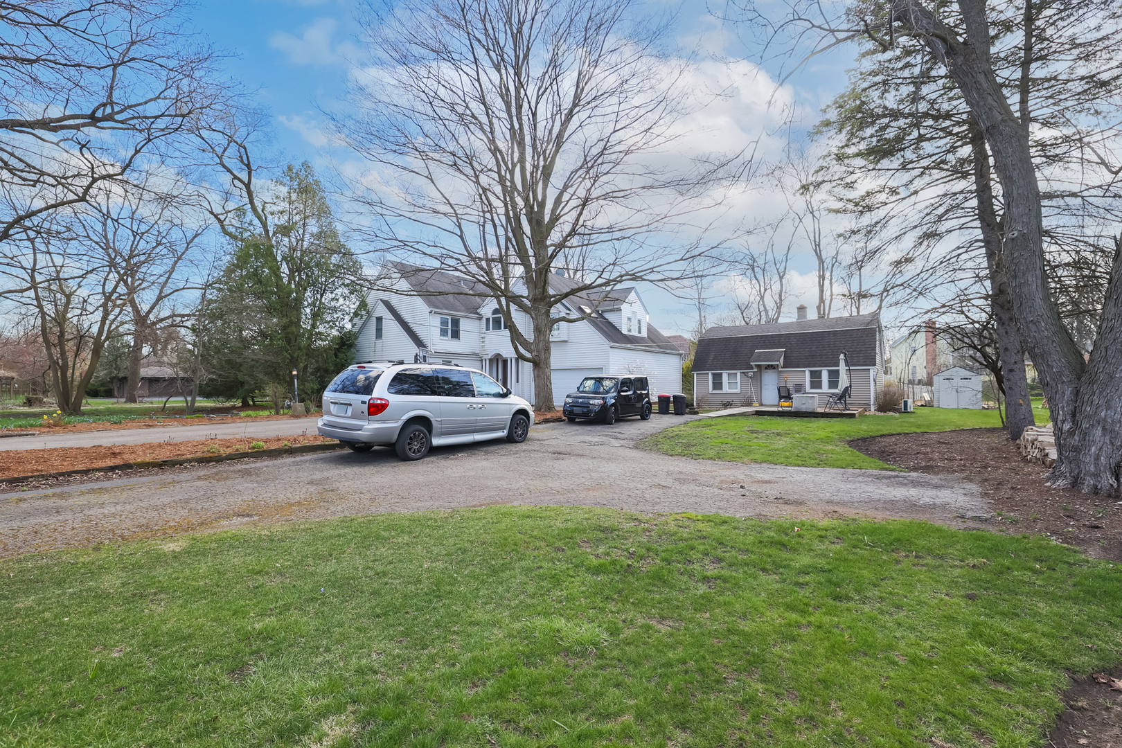 5938 Dunham Road Downers Grove, IL 60516 - Photo 6 of 11 a view of a house with a yard and garage