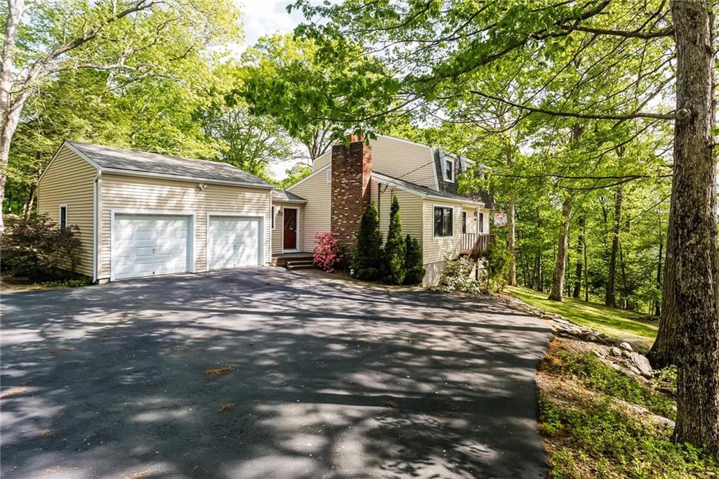 37 Punkup Road Oxford, CT 06478 - Photo 1 of 1 a backyard of a house with large trees and outdoor seating