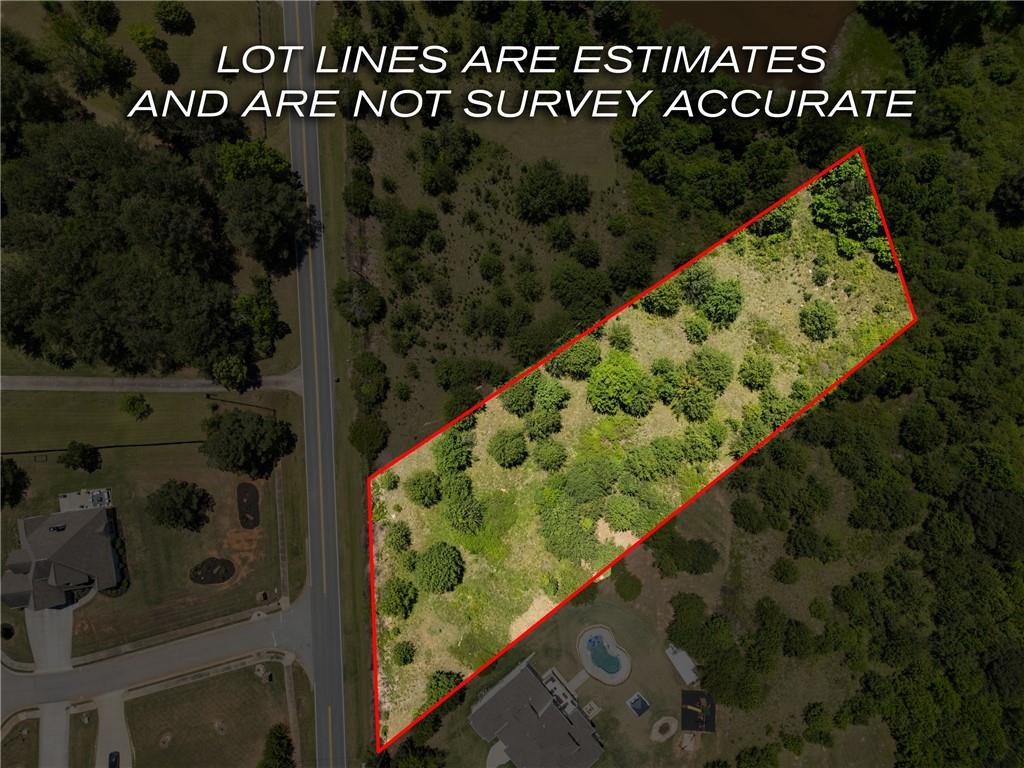 6707 Bishop Road Fairburn, GA 30213 - Photo 1 of 10 a view of a wooden fence