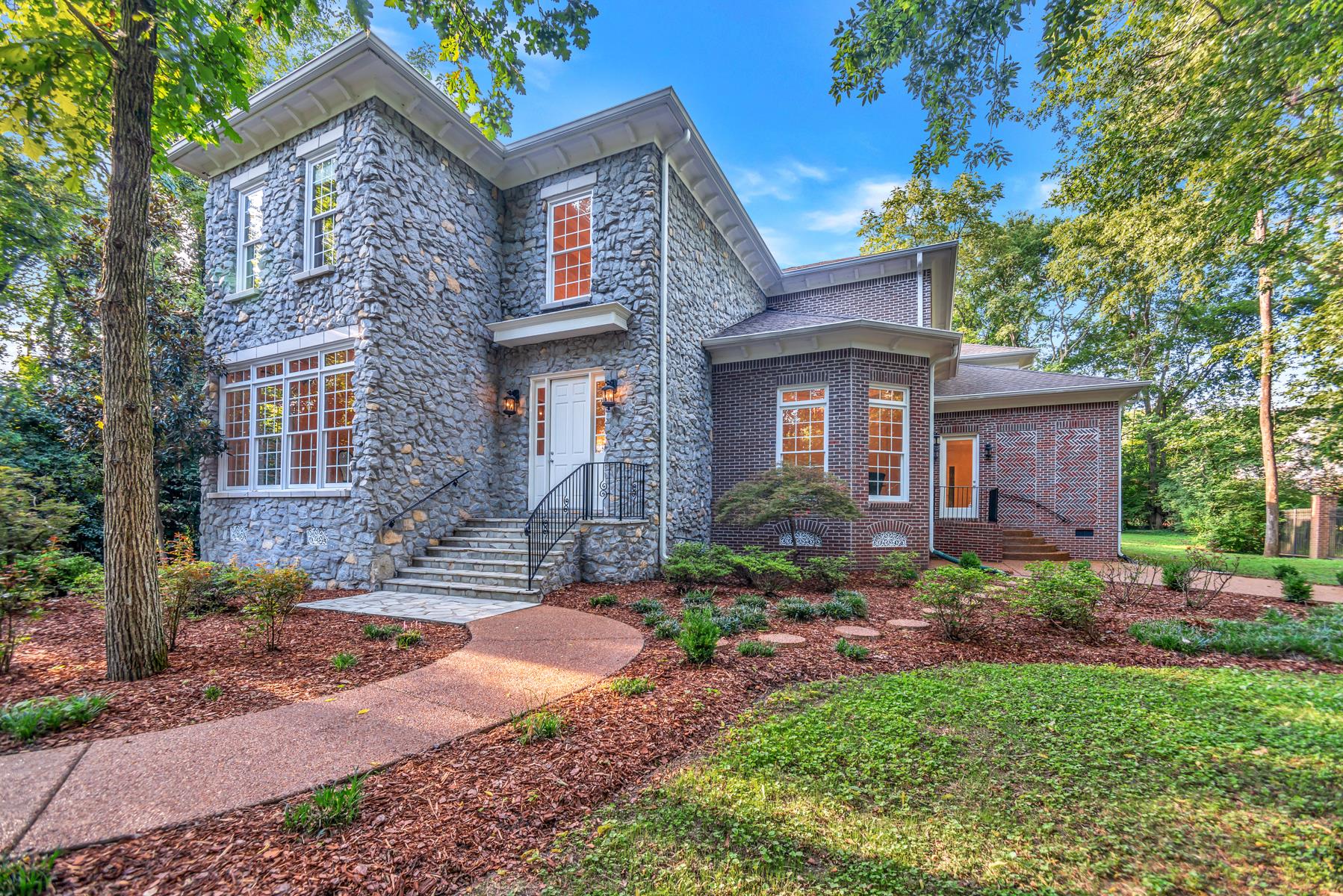 4006 Harding Place Nashville, TN 37215 - Photo 2 of 30 a front view of a house with garden