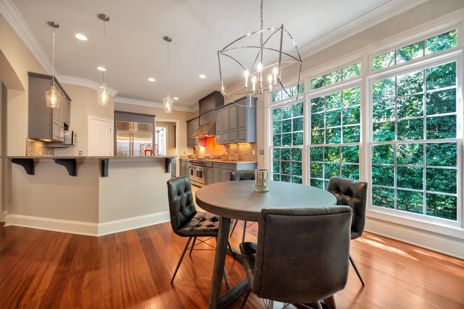 4006 Harding Place Nashville, TN 37215 - Photo 12 of 30 a dining room with furniture a chandelier and wooden floor