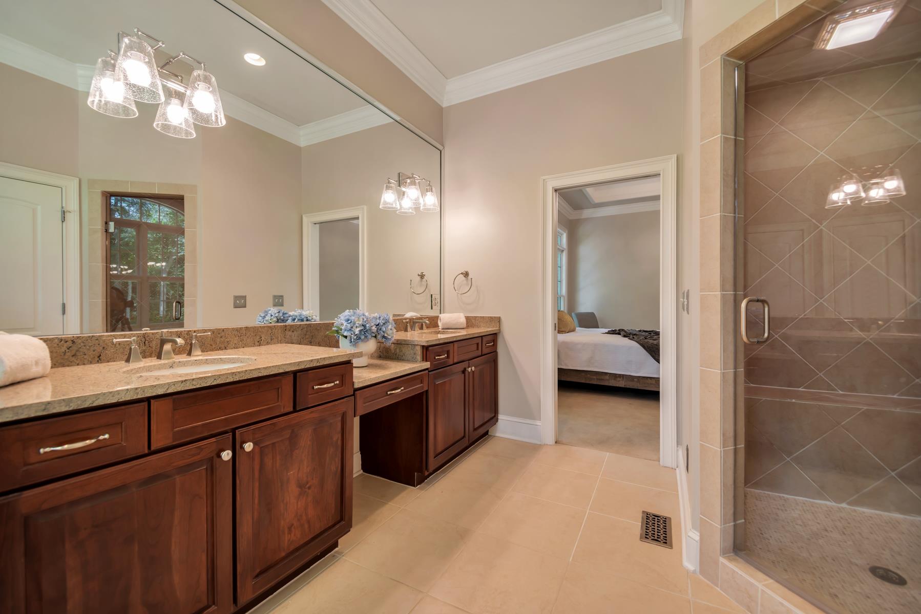 4006 Harding Place Nashville, TN 37215 - Photo 20 of 30 a en suite bathroom with a double vanity sink and a mirror