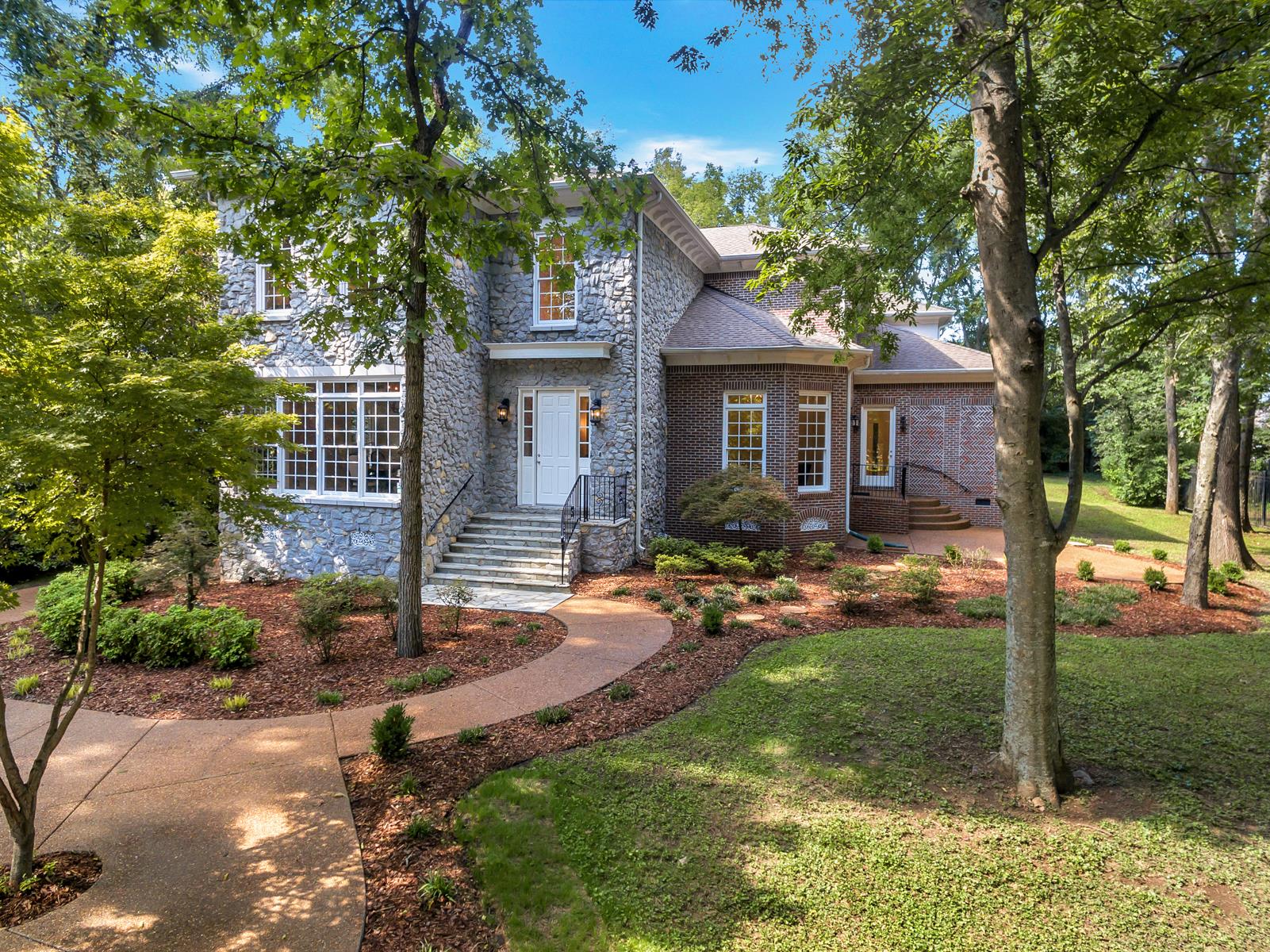 4006 Harding Place Nashville, TN 37215 - Photo 3 of 30 a front view of a house with garden