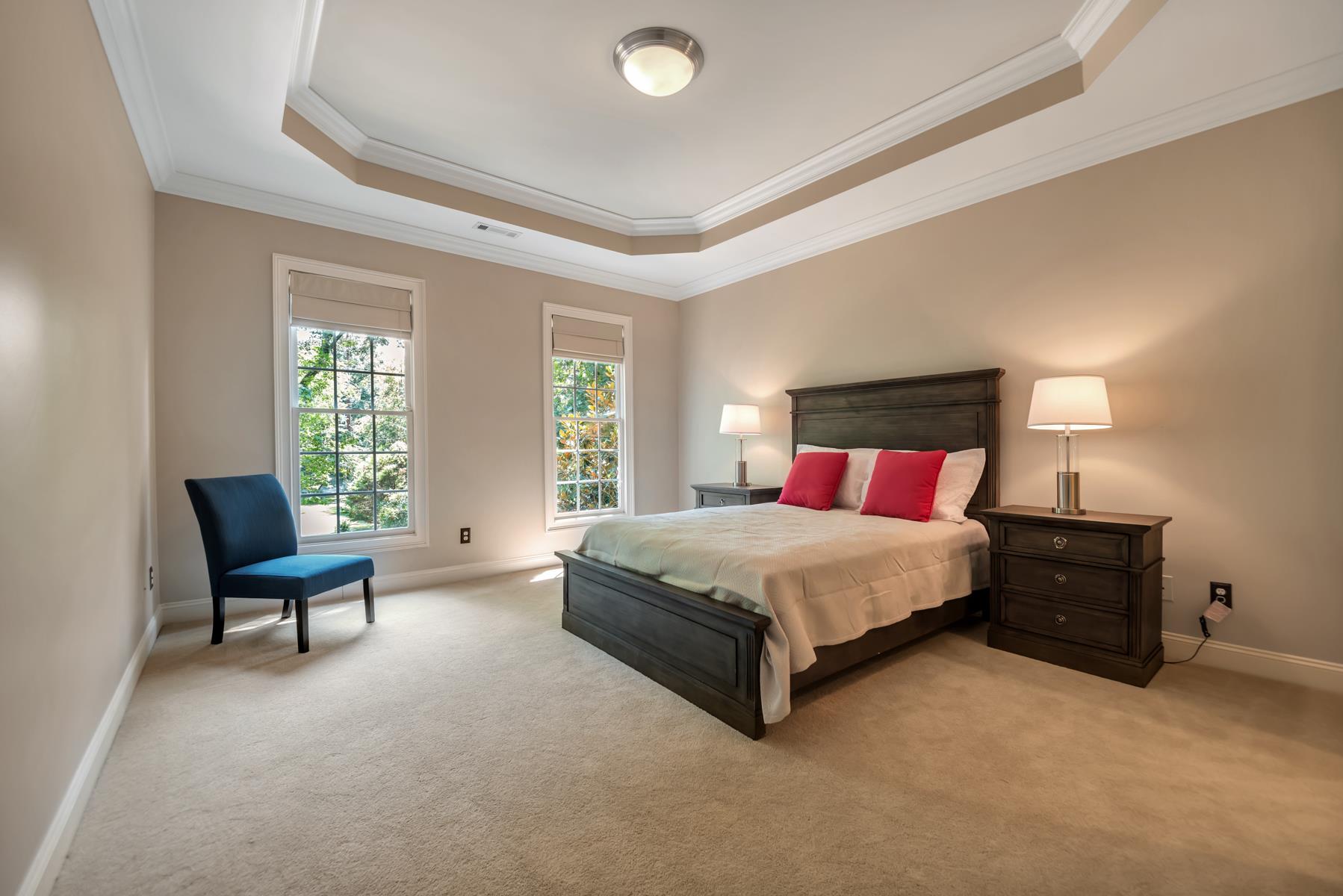 4006 Harding Place Nashville, TN 37215 - Photo 21 of 30 a spacious bedroom with a bed and chair