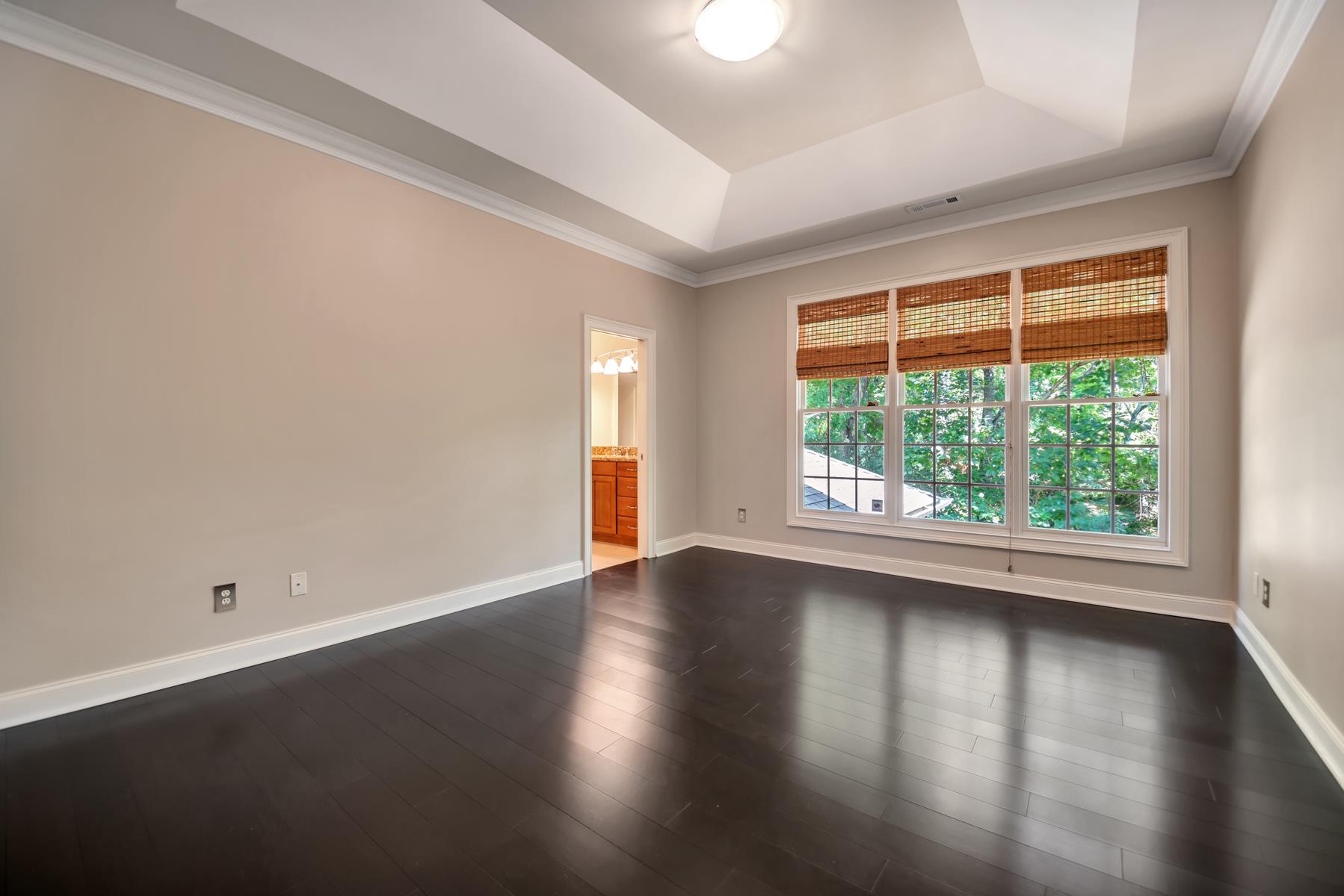 4006 Harding Place Nashville, TN 37215 - Photo 23 of 30 an empty room with wooden floor and windows