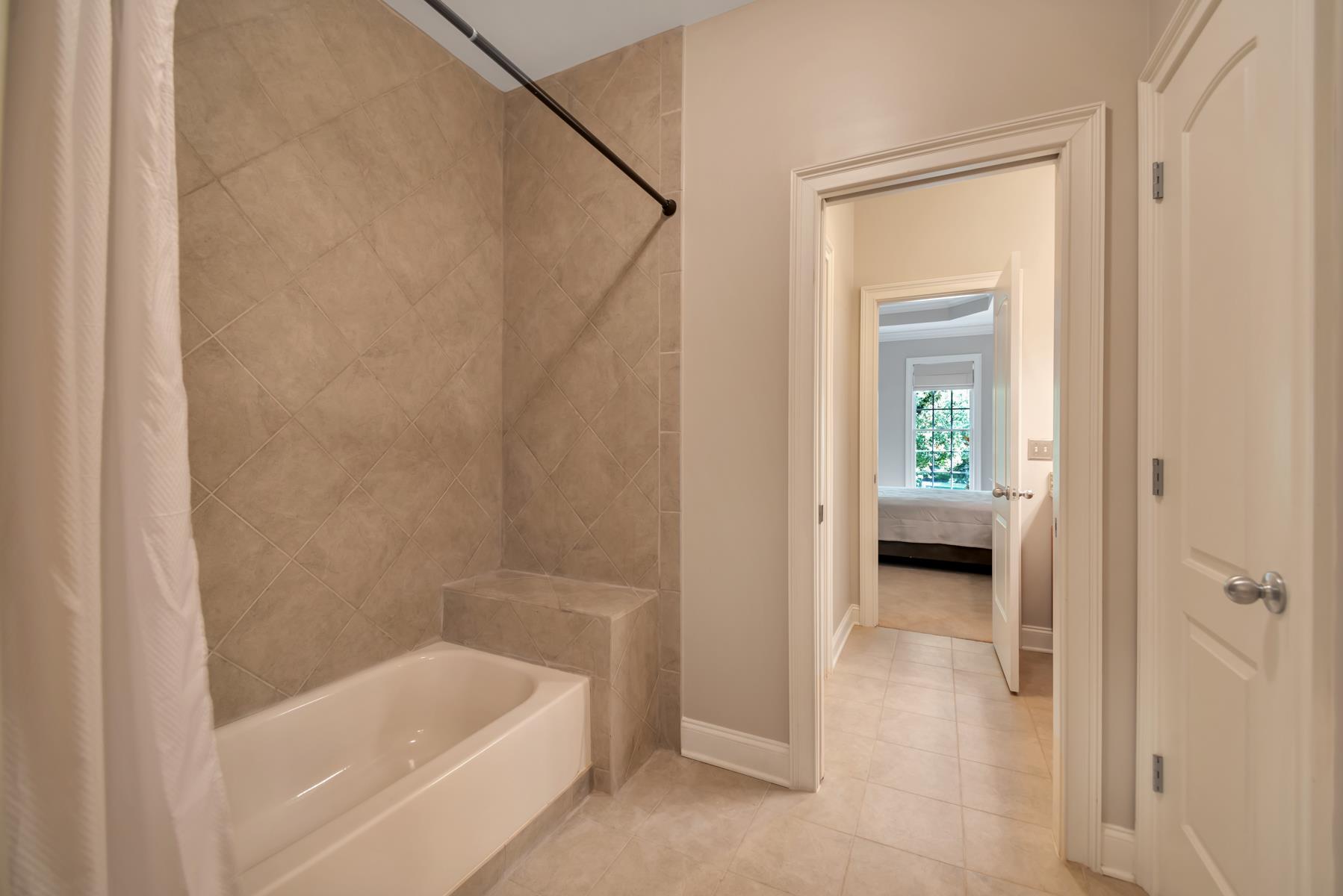 4006 Harding Place Nashville, TN 37215 - Photo 28 of 30 a bathroom with a tub shower and a sink