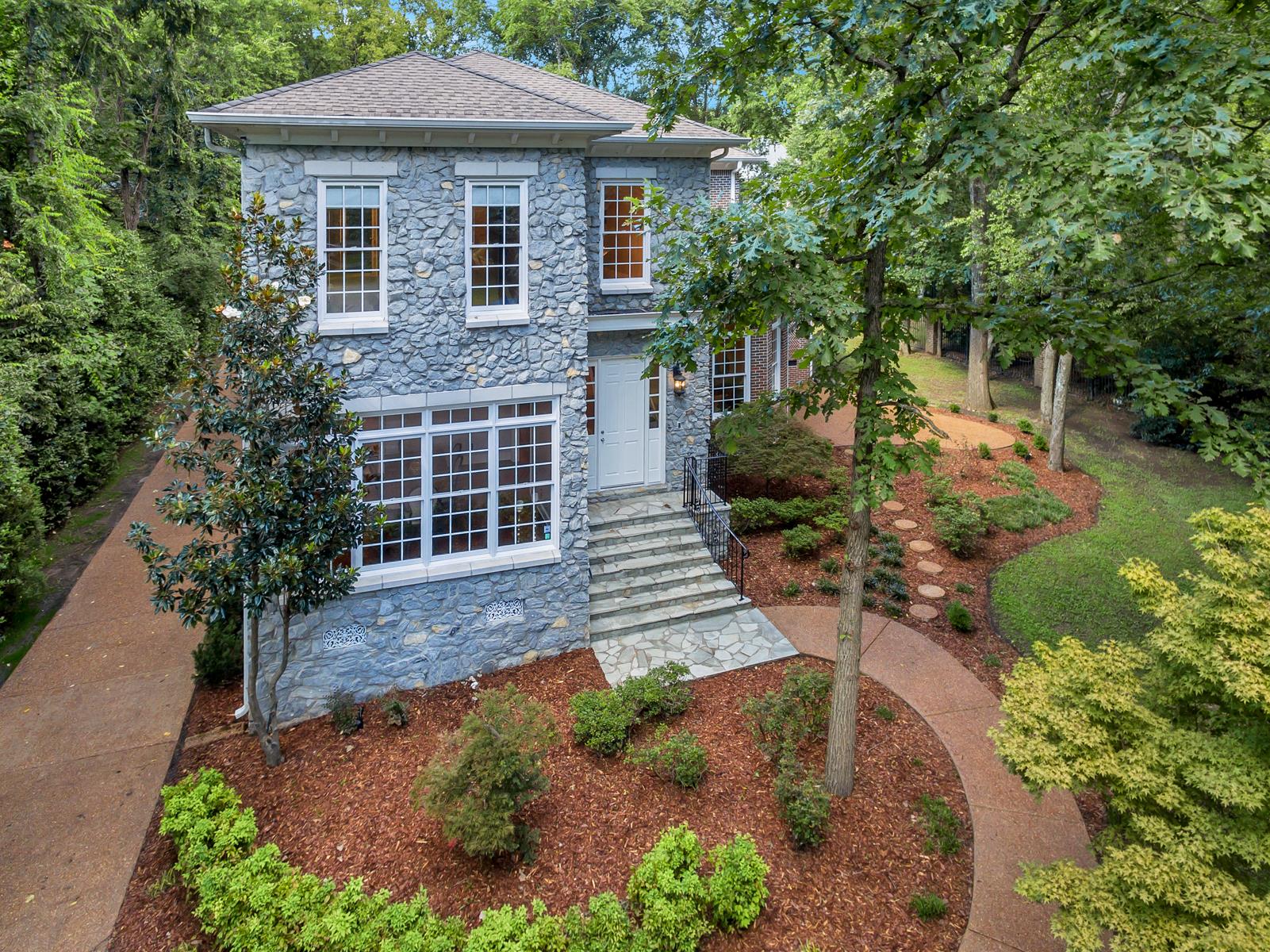 4006 Harding Place Nashville, TN 37215 - Photo 4 of 30 a front view of a house with garden