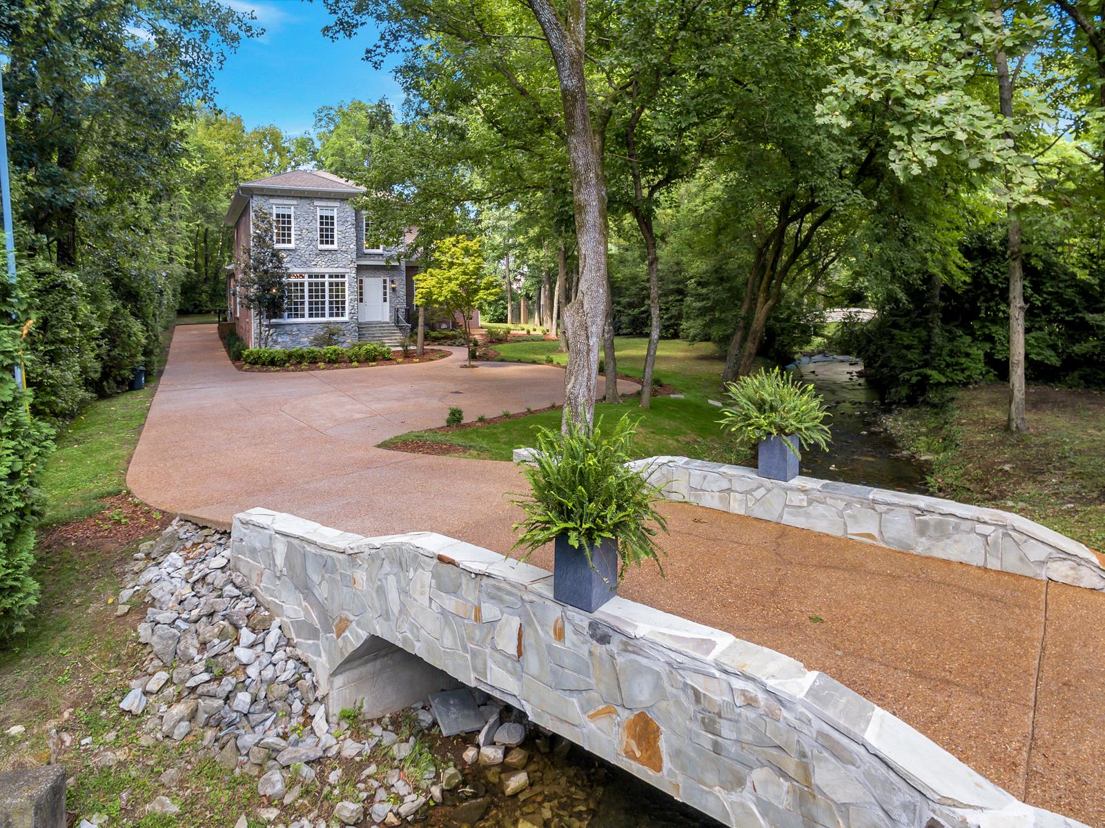 4006 Harding Place Nashville, TN 37215 - Photo 5 of 30 a view of a house with a yard and large trees