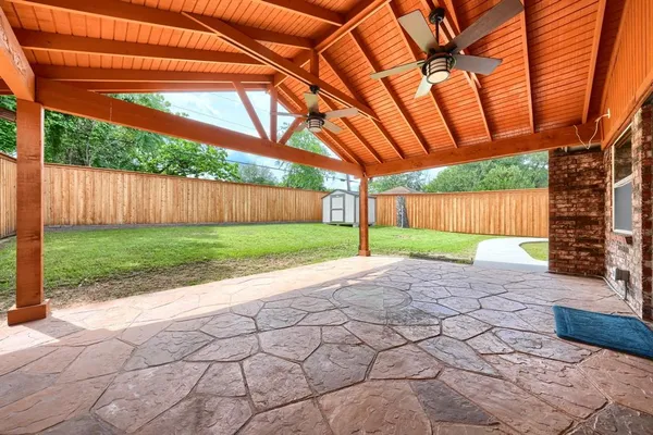 a view of a backyard with a tub