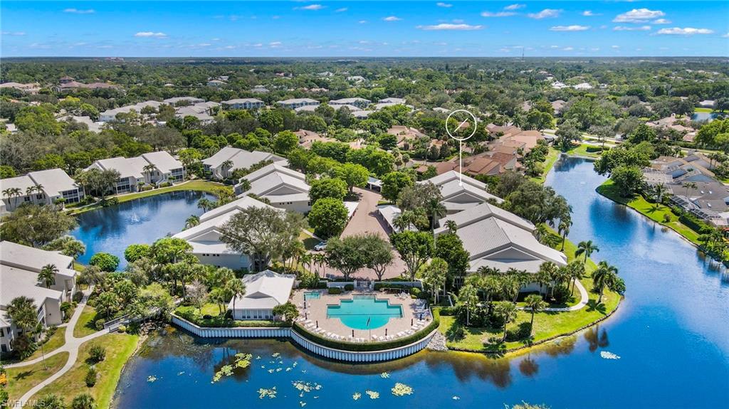 793 Willowbrook Drive, Unit 104 Naples, FL 34108 - Photo 11 of 38 an aerial view of a house with swimming pool and outdoor seating