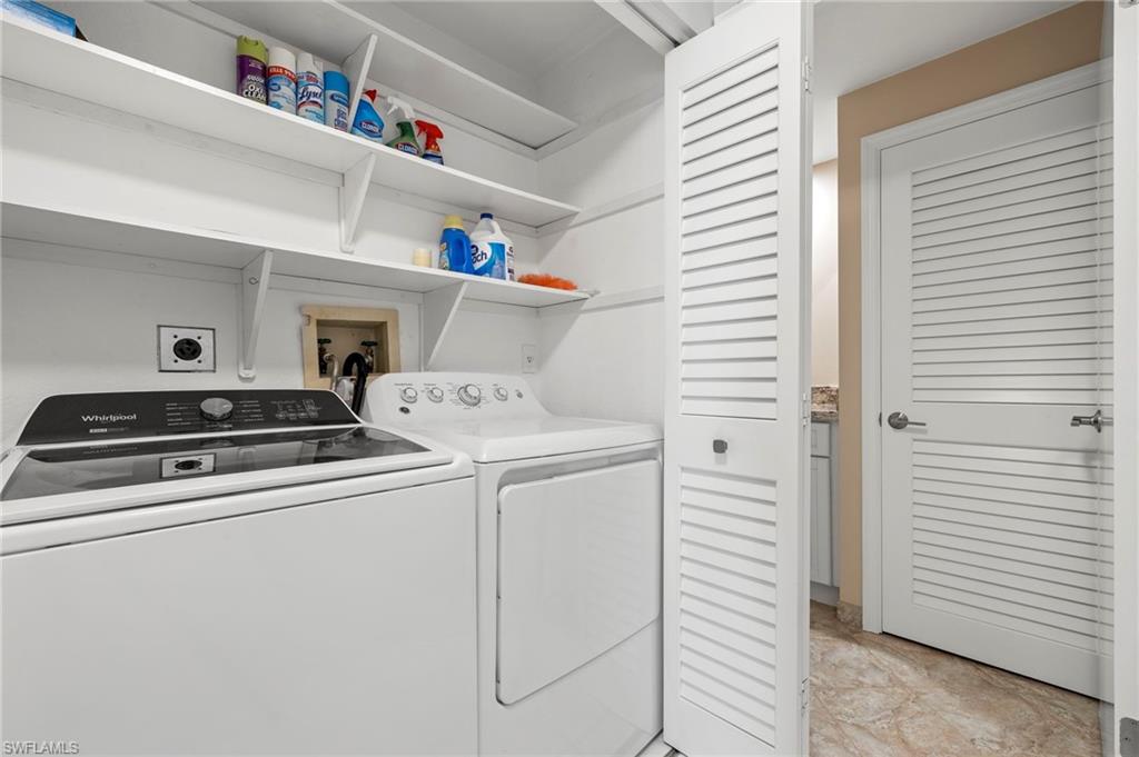 793 Willowbrook Drive, Unit 104 Naples, FL 34108 - Photo 27 of 38 a utility room with dryer and washer