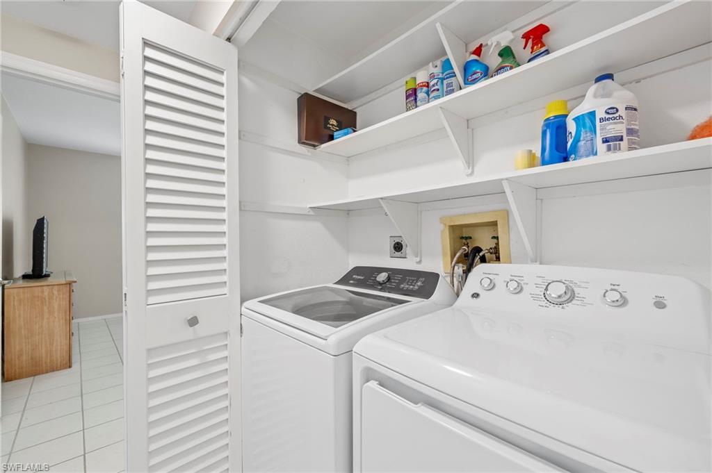 793 Willowbrook Drive, Unit 104 Naples, FL 34108 - Photo 28 of 38 a utility room with dryer and washer