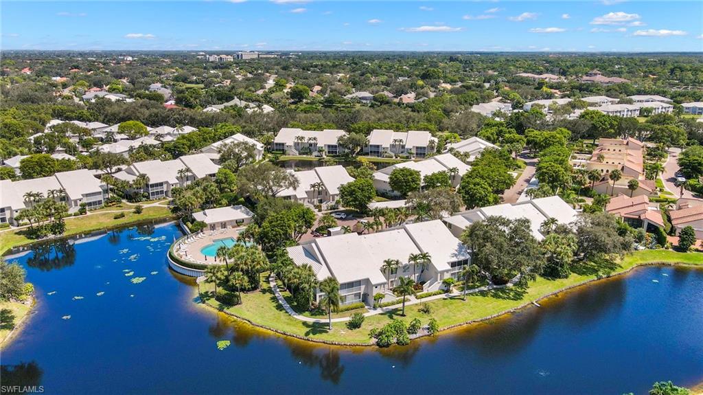 793 Willowbrook Drive, Unit 104 Naples, FL 34108 - Photo 5 of 38 an aerial view of residential houses with outdoor space and swimming pool