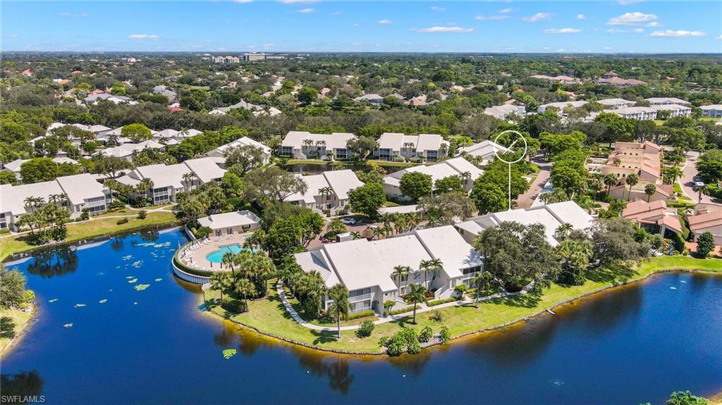 793 Willowbrook Drive, Unit 104 Naples, FL 34108 - Photo 6 of 38 an aerial view of residential houses with outdoor space and swimming pool