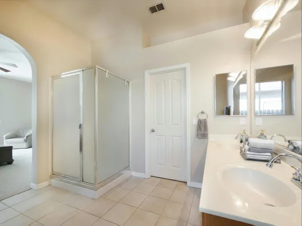 a bedroom with a bed and a view of bathroom