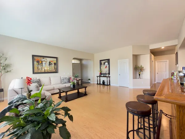 a living room with fireplace furniture and a fireplace