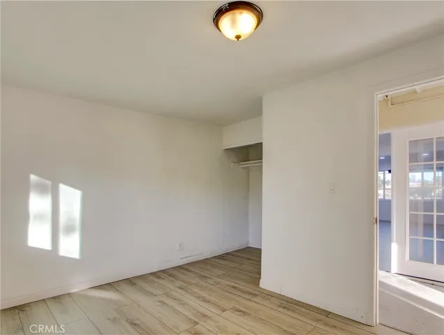 a kitchen with granite countertop a sink a stove and cabinets