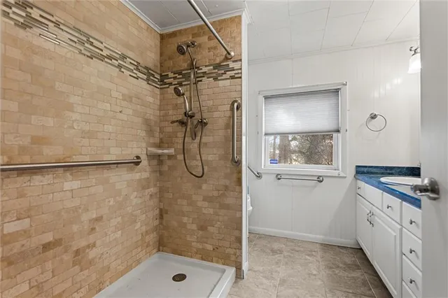 a bathroom with a shower and a sink