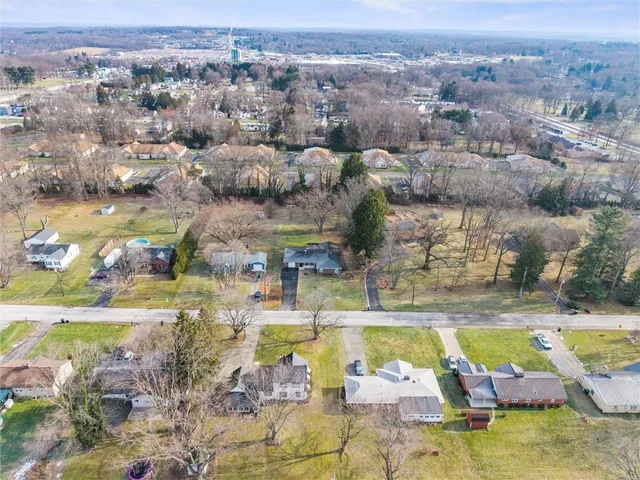 an aerial view of residential houses with swimming pool