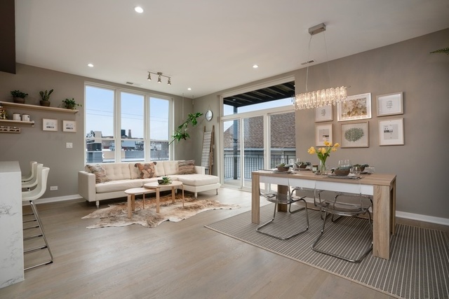 1708 West Cermak Road, Unit 2E Chicago, IL 60608 - Photo 2 of 49 a living room with furniture large window and wooden floor