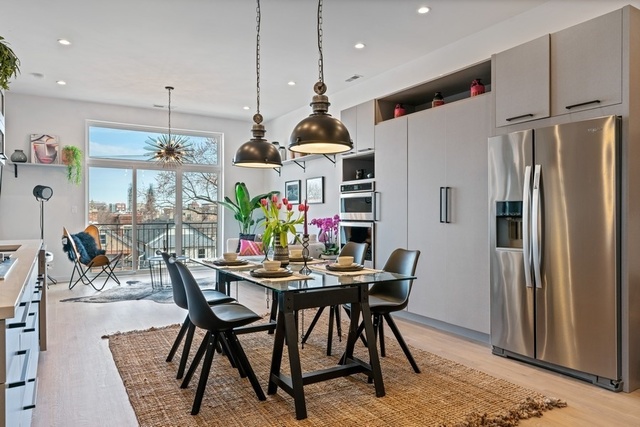 1708 West Cermak Road, Unit 2E Chicago, IL 60608 - Photo 11 of 49 a dining room filled chandelier and wooden floor