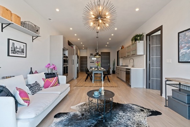 1708 West Cermak Road, Unit 2E Chicago, IL 60608 - Photo 12 of 49 a living room with furniture and kitchen view