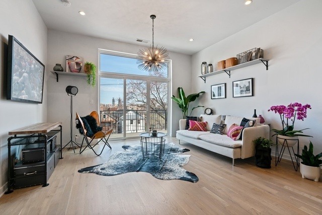 1708 West Cermak Road, Unit 2E Chicago, IL 60608 - Photo 14 of 49 a living room with furniture chandelier and a chandelier