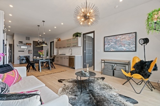 1708 West Cermak Road, Unit 2E Chicago, IL 60608 - Photo 16 of 49 a living room with furniture and kitchen view