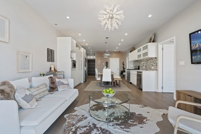 1708 West Cermak Road, Unit 2E Chicago, IL 60608 - Photo 27 of 49 a living room with stainless steel appliances furniture a rug and a kitchen view