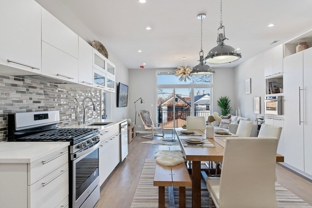 1708 West Cermak Road, Unit 2E Chicago, IL 60608 - Photo 30 of 49 a kitchen with stove and cabinets