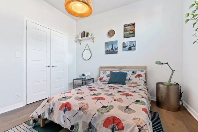 1708 West Cermak Road, Unit 2E Chicago, IL 60608 - Photo 38 of 49 a bedroom with a bed and painting on the wall