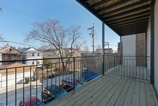 1708 West Cermak Road, Unit 2E Chicago, IL 60608 - Photo 42 of 49 a view of a balcony with wooden floor