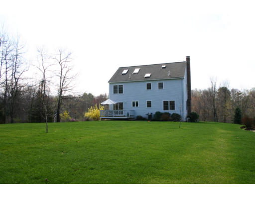 16 Michael Road Wayland, MA 01778 - Photo 2 of 9 a view of a backyard with large trees