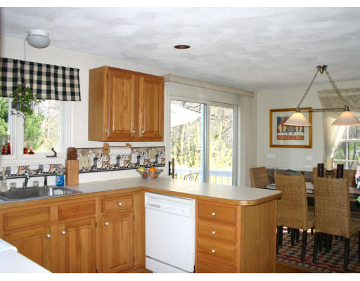 16 Michael Road Wayland, MA 01778 - Photo 6 of 9 a kitchen with granite countertop a sink cabinets and window