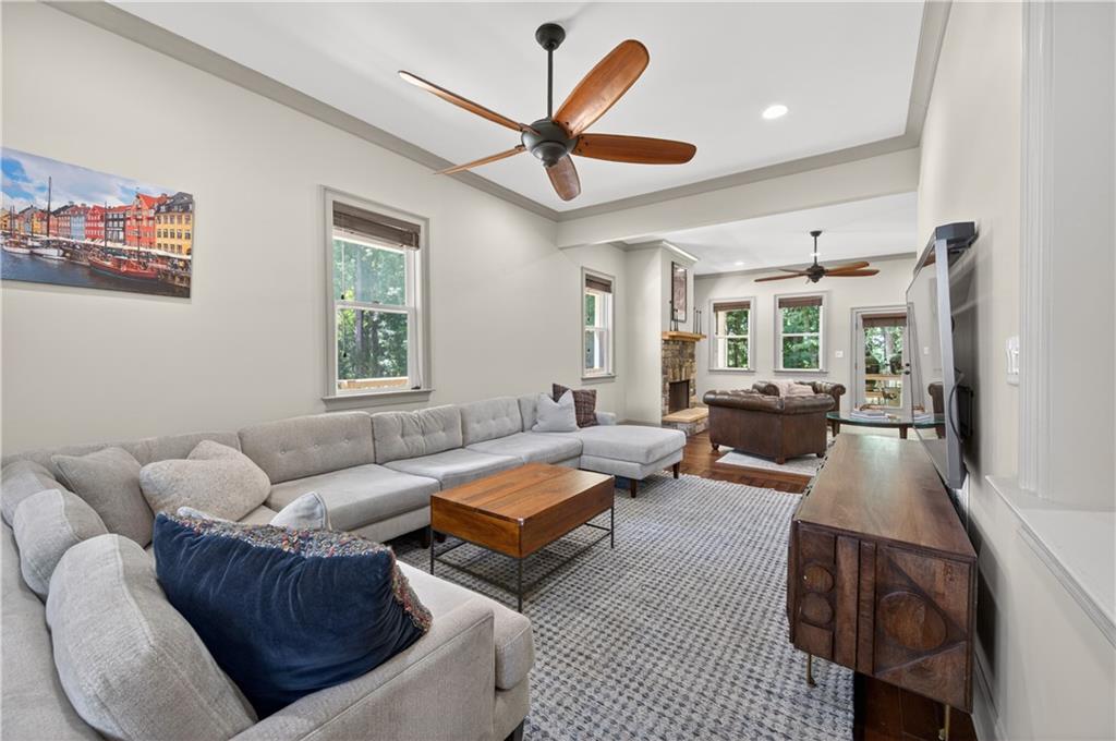 632 Geiger Road Jefferson, GA 30549 - Photo 12 of 55 a living room with furniture a clock and a ceiling fan