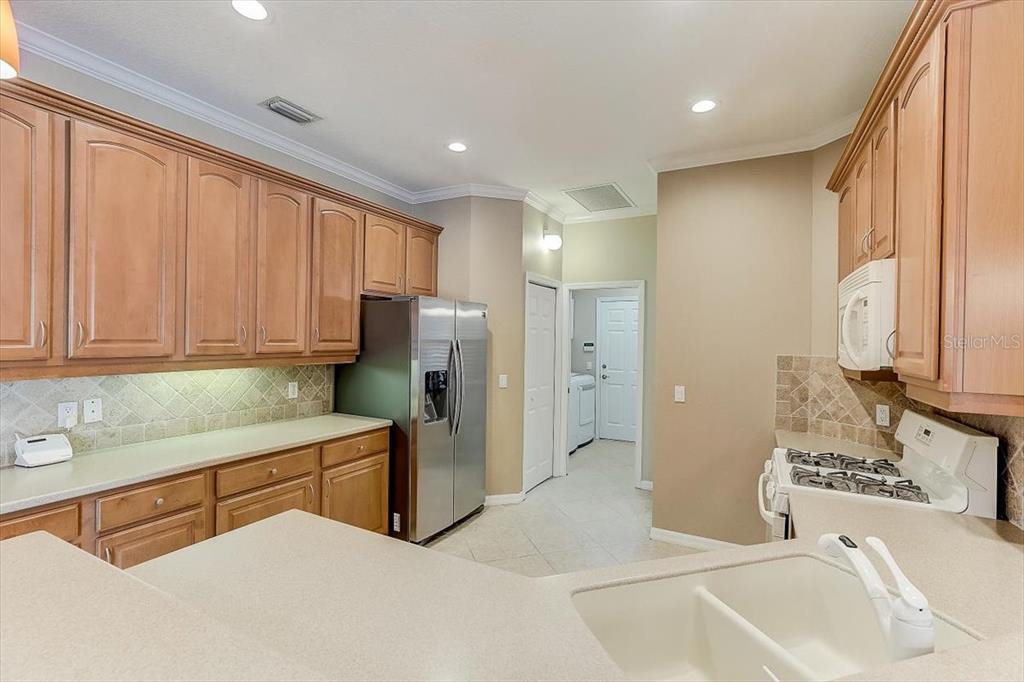 6214 Warbler Lane Lakewood Ranch, FL 34202 - Photo 11 of 40 a bedroom with a bed and a sink