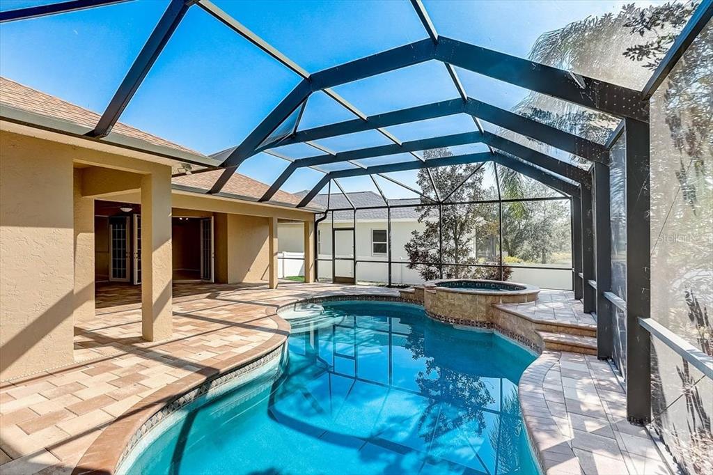 6214 Warbler Lane Lakewood Ranch, FL 34202 - Photo 32 of 40 a view of a swimming pool with sitting area
