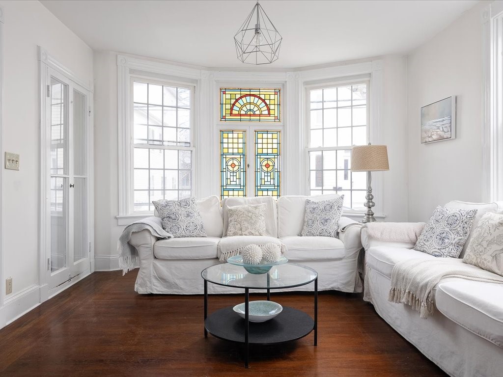 43 Howard Street Newport, RI 02840 - Photo 10 of 29 Living room with stained glass windows