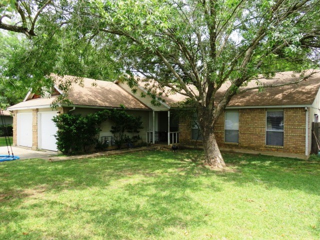 815 Lexington Road Elgin, TX 78621 - Photo 1 of 1 a front view of house with yard and green space