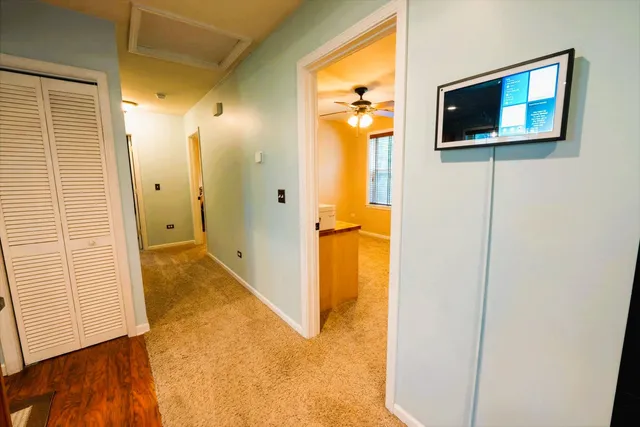 a view of a bathroom from a hallway