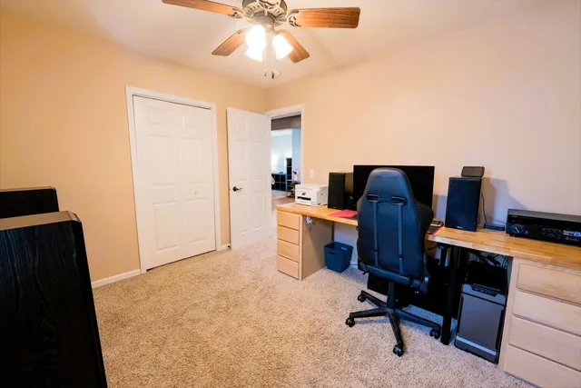 a view of a workspace with furniture